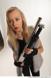 NIKOL STANDING POSE WITH SHOTGUN